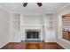 Fireplace with built-in shelving on either side at 1362 Meadow Creek Nw Way, Acworth, GA 30102