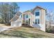 Two-story house with a two-car garage and landscaping at 1362 Meadow Creek Nw Way, Acworth, GA 30102