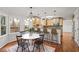 Eat-in kitchen offers a breakfast bar, pendant lighting, and large windows at 1362 Meadow Creek Nw Way, Acworth, GA 30102