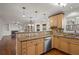 Kitchen features granite countertops, light wood cabinets, and stainless steel appliances at 1362 Meadow Creek Nw Way, Acworth, GA 30102