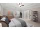 Serene main bedroom features a tray ceiling, a ceiling fan, and neutral decor at 1362 Meadow Creek Nw Way, Acworth, GA 30102