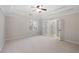 Spacious main bedroom featuring a tray ceiling and french doors leading to the bathroom at 1362 Meadow Creek Nw Way, Acworth, GA 30102