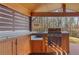 Outdoor kitchen featuring wood cabinets, built-in grill, and a counter for meal preparation at 1362 Meadow Creek Nw Way, Acworth, GA 30102