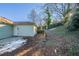 Backyard with retaining wall, concrete patio and detached building at 1453 Graham Sw St, Atlanta, GA 30310