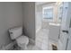 Updated bathroom with a bathtub, toilet and vanity at 1453 Graham Sw St, Atlanta, GA 30310