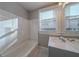 Clean bathroom with a shower/tub combo and vanity at 1453 Graham Sw St, Atlanta, GA 30310