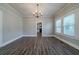 Elegant dining room with chandelier and hardwood floors at 1453 Graham Sw St, Atlanta, GA 30310