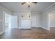 Living room featuring hardwood floors, fireplace, and neutral walls at 1453 Graham Sw St, Atlanta, GA 30310