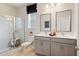 Bathroom features a double sink vanity, walk-in shower, and modern fixtures at 1603 Caldwell Bend Ln, Dacula, GA 30019