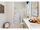 Well-lit bathroom featuring a glass-enclosed shower and double vanity at 1603 Caldwell Bend Ln, Dacula, GA 30019