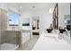 Modern primary bathroom with a glass enclosed shower, soaking tub, and double vanity at 1603 Caldwell Bend Ln, Dacula, GA 30019