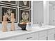 Bright bathroom featuring double sinks with white cabinets and stylish decorative accents at 1603 Caldwell Bend Ln, Dacula, GA 30019