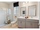 Modern bathroom with double vanity, shower, and tiled floors at 1603 Caldwell Bend Ln, Dacula, GA 30019