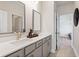 Modern bathroom with double vanity and grey cabinets at 1603 Caldwell Bend Ln, Dacula, GA 30019