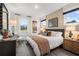 Bright bedroom with hardwood floors, natural light, a large bed and coordinated furniture at 1603 Caldwell Bend Ln, Dacula, GA 30019