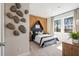 Stylish bedroom with unique headboard design and a view of the outdoors at 1603 Caldwell Bend Ln, Dacula, GA 30019