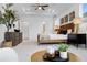 Spacious bedroom with large windows, decorative tree, and modern decor at 1603 Caldwell Bend Ln, Dacula, GA 30019