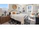 A cozy bedroom features a large bed, nightstands, and natural light at 1603 Caldwell Bend Ln, Dacula, GA 30019