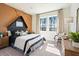 Charming bedroom with a distinct headboard and sunlit window at 1603 Caldwell Bend Ln, Dacula, GA 30019