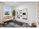 Bright bonus room with hardwood floors, a meditation space and a large window at 1603 Caldwell Bend Ln, Dacula, GA 30019
