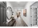 Entryway with dark wood floors, decoratives mirrors, and dark wood seating at 1603 Caldwell Bend Ln, Dacula, GA 30019