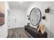 Entryway featuring wood floors, decorations on the walls and a decorative mirror at 1603 Caldwell Bend Ln, Dacula, GA 30019