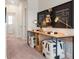 Hallway with office nook featuring a long desk and creative wall art at 1603 Caldwell Bend Ln, Dacula, GA 30019