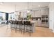 Modern kitchen with light gray cabinets, island, and stainless steel appliances at 1603 Caldwell Bend Ln, Dacula, GA 30019