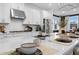 Stylish kitchen island with quartz countertops, undermount sink and stainless steel appliances at 1603 Caldwell Bend Ln, Dacula, GA 30019