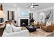 Comfortable living room with fireplace, plush seating, and modern decor, ideal for relaxation at 1603 Caldwell Bend Ln, Dacula, GA 30019