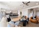 Bright living room showcases an open concept layout, with views of the kitchen and a staircase to the second floor at 1603 Caldwell Bend Ln, Dacula, GA 30019