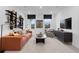 Relaxing living room with comfortable seating, custom shelving, and a modern entertainment center at 1603 Caldwell Bend Ln, Dacula, GA 30019
