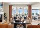 Bright living area features large windows, comfortable seating, and an open connection to the adjacent dining space at 1603 Caldwell Bend Ln, Dacula, GA 30019