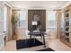 Stylish office space with a modern desk, decor, and natural light, perfect for a productive work environment at 1603 Caldwell Bend Ln, Dacula, GA 30019