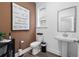 Elegant powder room featuring a modern sink, decorative mirror, and stylish accents at 1603 Caldwell Bend Ln, Dacula, GA 30019