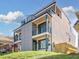 Modern two-story home featuring a gray exterior with black trim and balconies on the upper floors at 337 Pine Ne St # A, Atlanta, GA 30308