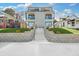 Modern three-story home with gray and white exterior, landscaped lawn, and stone retaining wall at 337 Pine Ne St # A, Atlanta, GA 30308