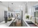 Modern kitchen with white cabinets, stainless steel appliances, and an eat-in island at 337 Pine Ne St # A, Atlanta, GA 30308