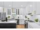 Bright, modern kitchen with stainless steel appliances, white cabinets, and a quartz countertop island at 337 Pine Ne St # A, Atlanta, GA 30308