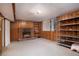 Finished basement with fireplace and built-in shelving at 3496 Wesley Chapel Rd, Decatur, GA 30034