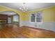 Dining room features hardwood floors and a chandelier at 3496 Wesley Chapel Rd, Decatur, GA 30034