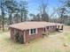 Brick ranch house with carport and large backyard at 3496 Wesley Chapel Rd, Decatur, GA 30034