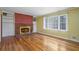 Living room with hardwood floors, brick fireplace and built-in shelves at 3496 Wesley Chapel Rd, Decatur, GA 30034