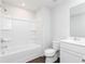 All white bathroom features a shower-tub combo, toilet, and vanity with sink at 512 Altamaha Ct, Locust Grove, GA 30248