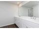 Bathroom with double vanity and a large mirror at 512 Altamaha Ct, Locust Grove, GA 30248