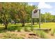 Dauser Trails Nature Center sign surrounded by lush landscaping and blooming trees in a serene park setting at 512 Altamaha Ct, Locust Grove, GA 30248