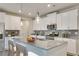 Well-lit kitchen featuring stainless steel appliances, granite countertops, and pendant lighting above the island at 512 Altamaha Ct, Locust Grove, GA 30248