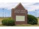 Locust Grove Middle School brick sign surrounded by greenery near the sports fields at 512 Altamaha Ct, Locust Grove, GA 30248