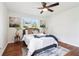 Spacious bedroom with hardwood floors, ceiling fan, and calming decor at 814 Bank Se St, Smyrna, GA 30080