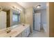 Bathroom with double vanity and separate tub and shower at 1708 Queen Victoria Ct, Locust Grove, GA 30248